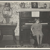 7:45 p.m. After dinner the family sits around in the living room. This is one of the daughters sitting on the stool for the organ (which does not work). Tip Estes family near Fowler, Indiana