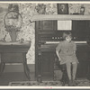 7:45 p.m. After dinner the family sits around in the living room. This is one of the daughters sitting on the stool for the organ (which does not work). Tip Estes family near Fowler, Indiana