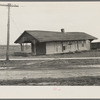 The old Louisville and Nashville Railroad station after the flood. Shawneetown, Illinois. Note flood marks on building