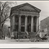 Bank in Shawneetown, Illinois, built by state in 1839. Note water tank (for drinking water purposes) on sidewalk, left