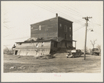 Old flour mill damaged by the flood. Note wrought iron streetlight fixture. Shawneetown, Illinois