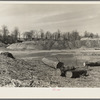 Spillway part of earthen dam with logs and debris from land which has been cleared. Martin County Development Project, Indiana