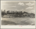 Spillway end of earthen dam from small hill in basin. Martin County Development Project, Indiana