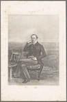 Portrait of a man sitting next to a second chair
