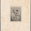 Portrait of a man and young boy standing next to him