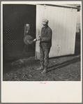 Tip Estes oils the spade before he puts it away. Near Fowler, Indiana