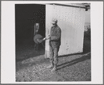 Tip Estes oils the spade before he puts it away. Near Fowler, Indiana