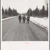 Lumberjacks walking to town after the winter work is finished. Forest County, Wisconsin