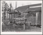 Stand for strapping in horses while being shod. Forest County lumber camp. Wisconsin