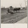Horse-drawn mud sled. Shawneetown, Illinois