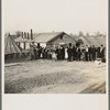 Men, women and children waiting in line to be fed. Tent City, Shawneetown, Illinois