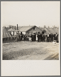 Men, women and children waiting in line to be fed. Tent City, Shawneetown, Illinois