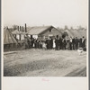 Men, women and children waiting in line to be fed. Tent City, Shawneetown, Illinois