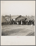 Men, women and children waiting in line to be fed. Tent City, Shawneetown, Illinois