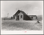 The home of Max Sparks and family near Long Lake, Wisconsin. The family was forced to move from the place they were buying to this shack because of inability to pay three dollars monthly which was the basis of the contract