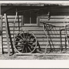 Machinery against the garage on Matt Henry's farm near Tipler, Wisconsin. Note primitive scythe rake