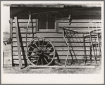 Machinery against the garage on Matt Henry's farm near Tipler, Wisconsin. Note primitive scythe rake