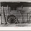 Machinery against the garage on Matt Henry's farm near Tipler, Wisconsin. Note primitive scythe rake