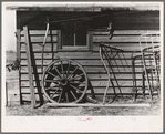 Machinery against the garage on Matt Henry's farm near Tipler, Wisconsin. Note primitive scythe rake