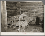 Bed in William Howell's home near Tipler, Wisconsin. He is a cut-over farmer with a family on relief