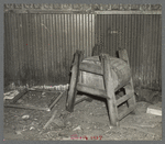 A homemade butter churn in an abandoned saloon at Mansfield, Michigan. A "bust" mining town