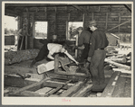 Sawing ties in a sawmill at Gibbs City, Michigan