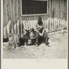 Black Aleck Dickinson and his dog Snoop. Dickinson is a single shacker in Iron County, Michigan