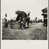 John Bastia doing his washing. He is a single shacker from Iron County, Michigan