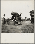 John Bastia doing his washing. He is a single shacker from Iron County, Michigan