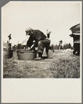 John Bastia doing his washing. He is a single shacker from Iron County, Michigan