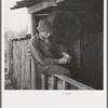 Son of William Shanard, cut-over farmer, near Silk Lake, Michigan, rolling a cigarette