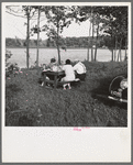 Family picnicking at roadside table on area to be acquired by Resettlement Administration. Allegan project, Michigan