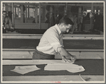 Louis Gushen, chief cutter in the cooperative garment factory at Jersey Homesteads, marks out the pattern of a woman's coat, which will be made in the factory, Hightstown, New Jersey