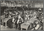 Interior of cooperative garment factory at Jersey Homesteads, showing some of eighty homesteaders at their work and some of the ladies' coats made by them. Hightstown, New Jersey