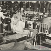 Interior of cooperative garment factory at Jersey Homesteads, showing some of eighty homesteaders at their work and some of the ladies' coats made by them. Hightstown, New Jersey