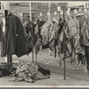 Half-made garments on the racks, awaiting final operations of the machines, in cooperative garment factory, Hightstown, New Jersey