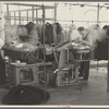 Steam pressing the cloth is one process in manufacturing women's coats at Jersey Homesteads, Hightstown