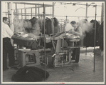 Steam pressing the cloth is one process in manufacturing women's coats at Jersey Homesteads, Hightstown