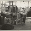 Steam pressing the cloth is one process in manufacturing women's coats at Jersey Homesteads, Hightstown