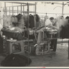 Steam pressing the cloth is one process in manufacturing women's coats at Jersey Homesteads, Hightstown