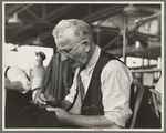 Eugene Isaacs, tailor, in the cooperative garment factory, Jersey Homesteads, Hightstown, New Jersey