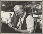 Eugene Isaacs, tailor, in the cooperative garment factory, Jersey Homesteads, Hightstown, New Jersey