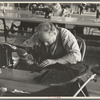 Closeup of cloak operator in cooperative garment factory at Jersey Homesteads, Hightstown, New Jersey