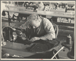 Closeup of cloak operator in cooperative garment factory at Jersey Homesteads, Hightstown, New Jersey