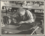Closeup of cloak operator in cooperative garment factory at Jersey Homesteads, Hightstown, New Jersey
