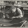 Closeup of cloak operator in cooperative garment factory at Jersey Homesteads, Hightstown, New Jersey