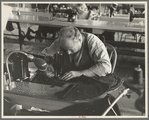Closeup of cloak operator in cooperative garment factory at Jersey Homesteads, Hightstown, New Jersey