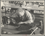 Closeup of cloak operator in cooperative garment factory at Jersey Homesteads, Hightstown, New Jersey