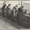 Molding hats in the millinery department of the cooperative garment factory at Jersey Homesteads