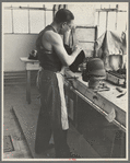 Molding hats in the millinery department of the cooperative garment factory at Jersey Homesteads